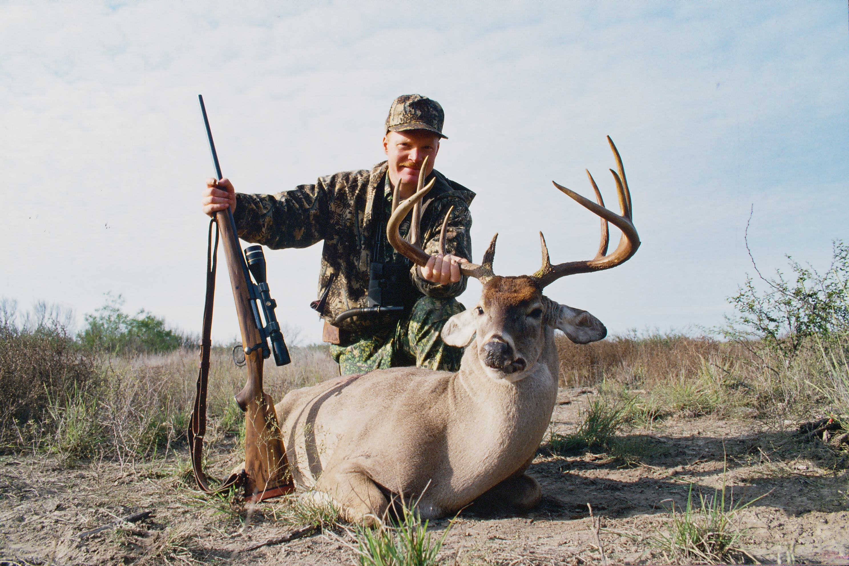 Through the 80s and 90s Boddington did much of his hunting with this beautiful, accurate 7mm Rem Mag by the late David Miller. Taken in South Texas at about 350 yards, this is one of his all-time best whitetails. 